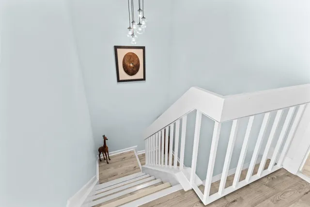 a view of a hallway with stairs