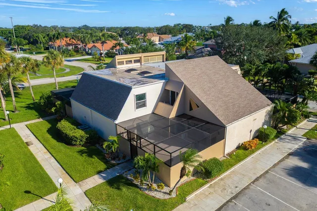 an aerial view of a house with a garden