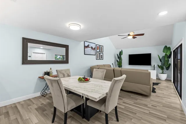 a view of a livingroom with furniture and a flat screen tv