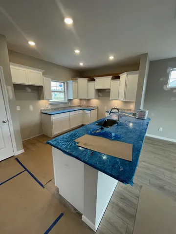 a kitchen with counter top space and appliances