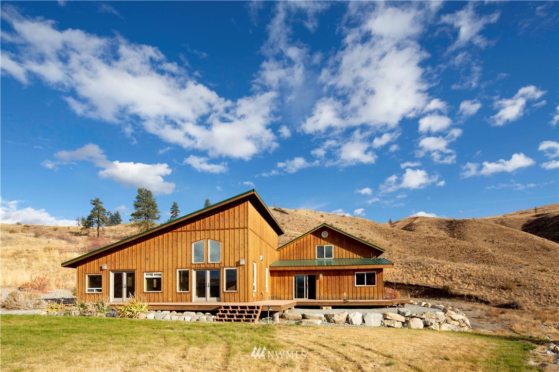 a view of a big house with a big yard