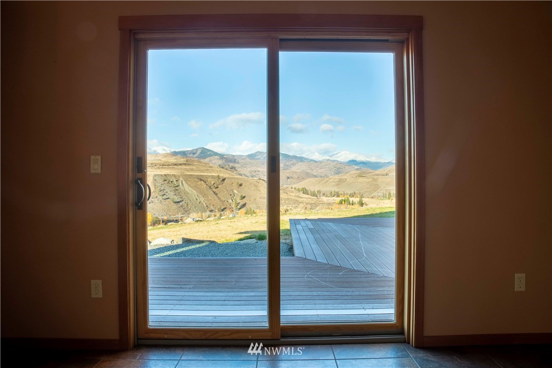 16 French Creek Road Pateros, WA 98846 - Photo 12 of 37 a view of a glass door with a yard from a room