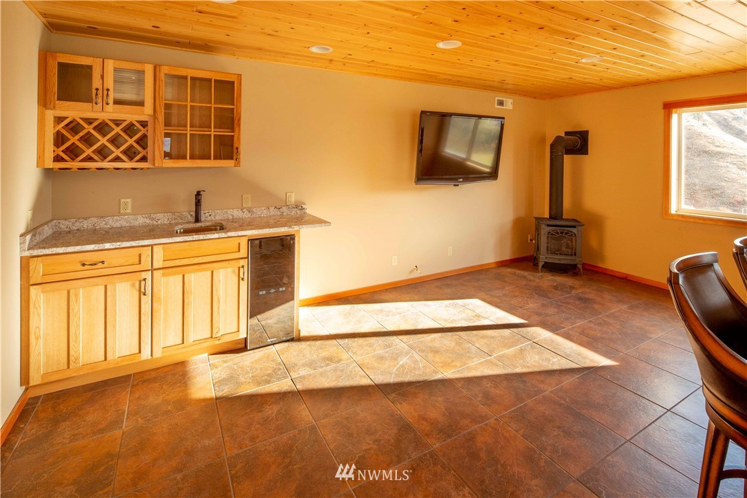 16 French Creek Road Pateros, WA 98846 - Photo 9 of 37 a view of a kitchen with a sink and a refrigerator