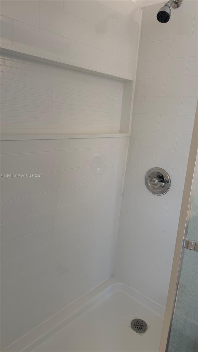 12764 Southwest 46th Lane, Unit 12764 Miami, FL 33175 - Photo 5 of 13 a close up of a bathtub