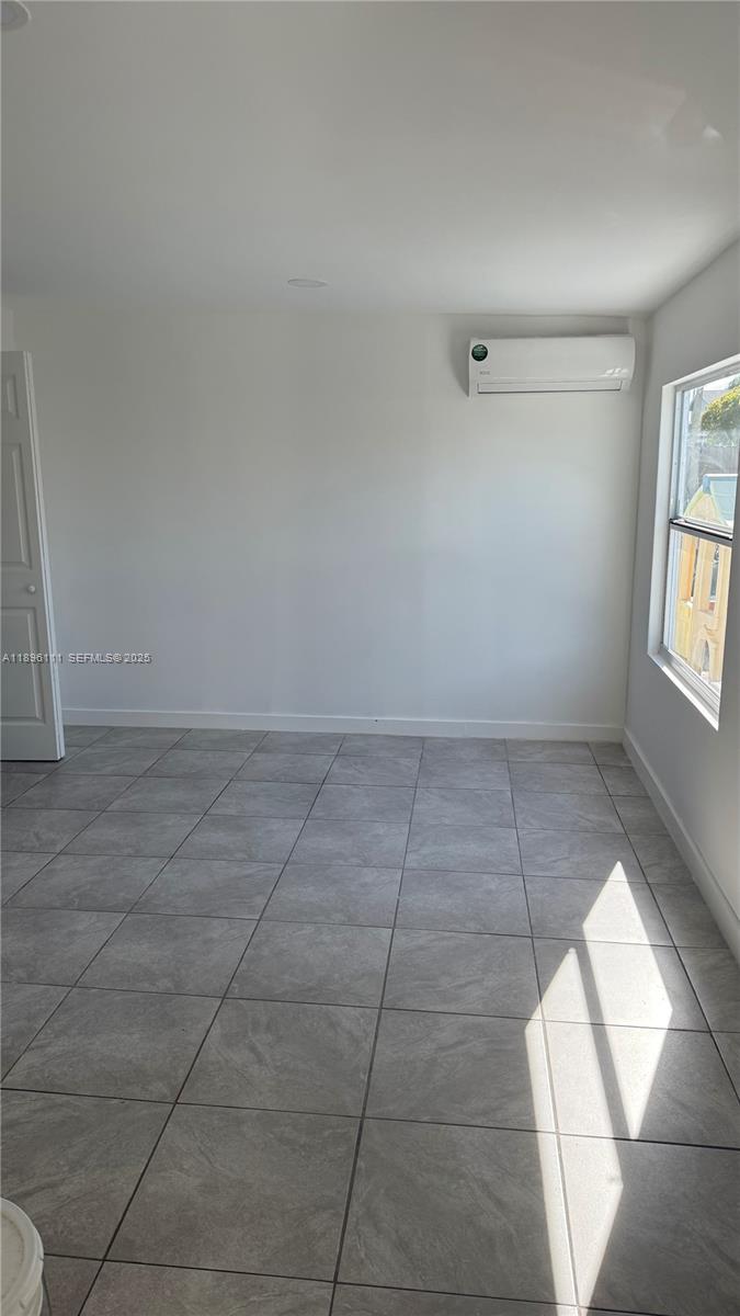 12764 Southwest 46th Lane, Unit 12764 Miami, FL 33175 - Photo 10 of 13 an empty room with windows