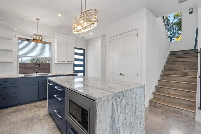 a kitchen with sink and window