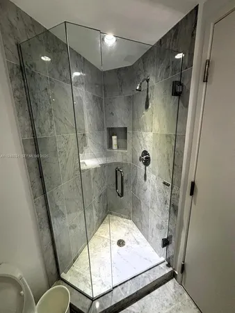 a bathroom with a tub and shower