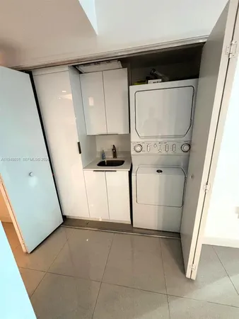 a view of a chairs and table in the balcony