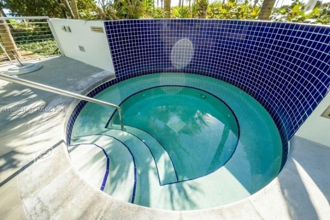 9401 Collins Avenue, Unit 401 Surfside, FL 33154 - Photo 17 of 28 a view of a swimming pool