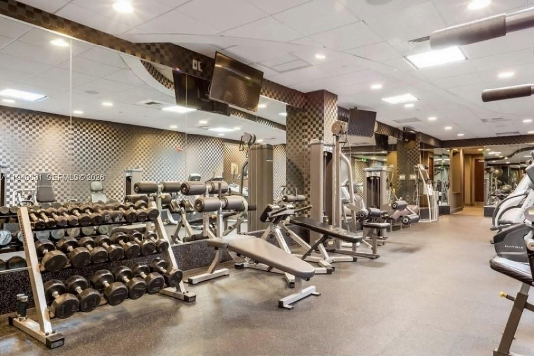 9401 Collins Avenue, Unit 401 Surfside, FL 33154 - Photo 18 of 28 a view of a room with gym equipment