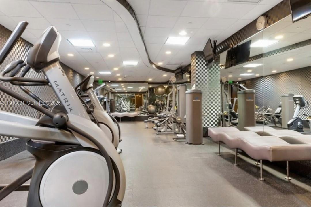 9401 Collins Avenue, Unit 401 Surfside, FL 33154 - Photo 19 of 28 a view of a room with gym equipment