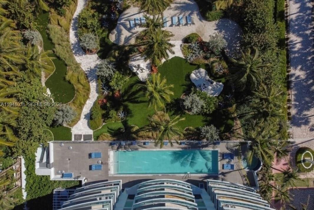 9401 Collins Avenue, Unit 401 Surfside, FL 33154 - Photo 23 of 28 an aerial view of a house with a yard