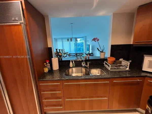 a kitchen with a sink and a window