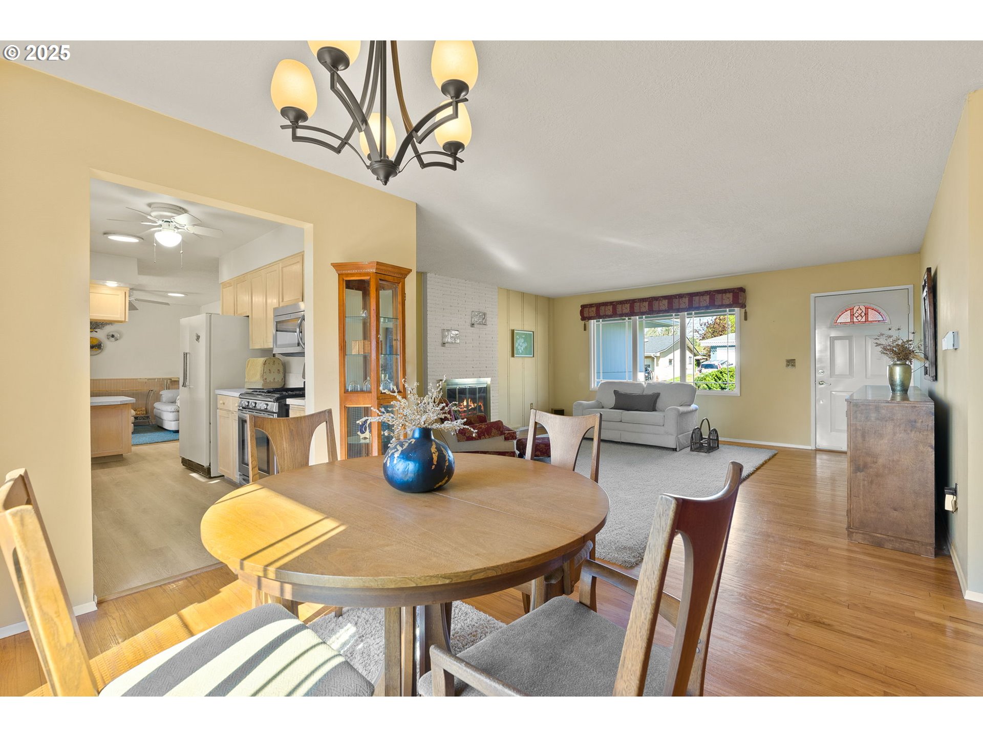 1055 Southeast 214th Avenue Gresham, OR 97030 - Photo 13 of 38 a view of a dining room with furniture and wooden floor