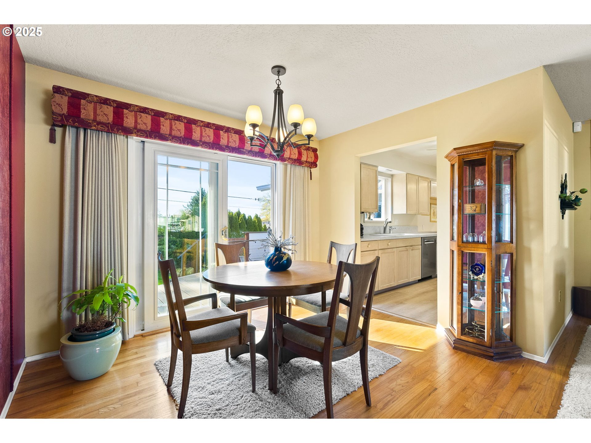 1055 Southeast 214th Avenue Gresham, OR 97030 - Photo 15 of 38 a view of a dining room with furniture window and wooden floor