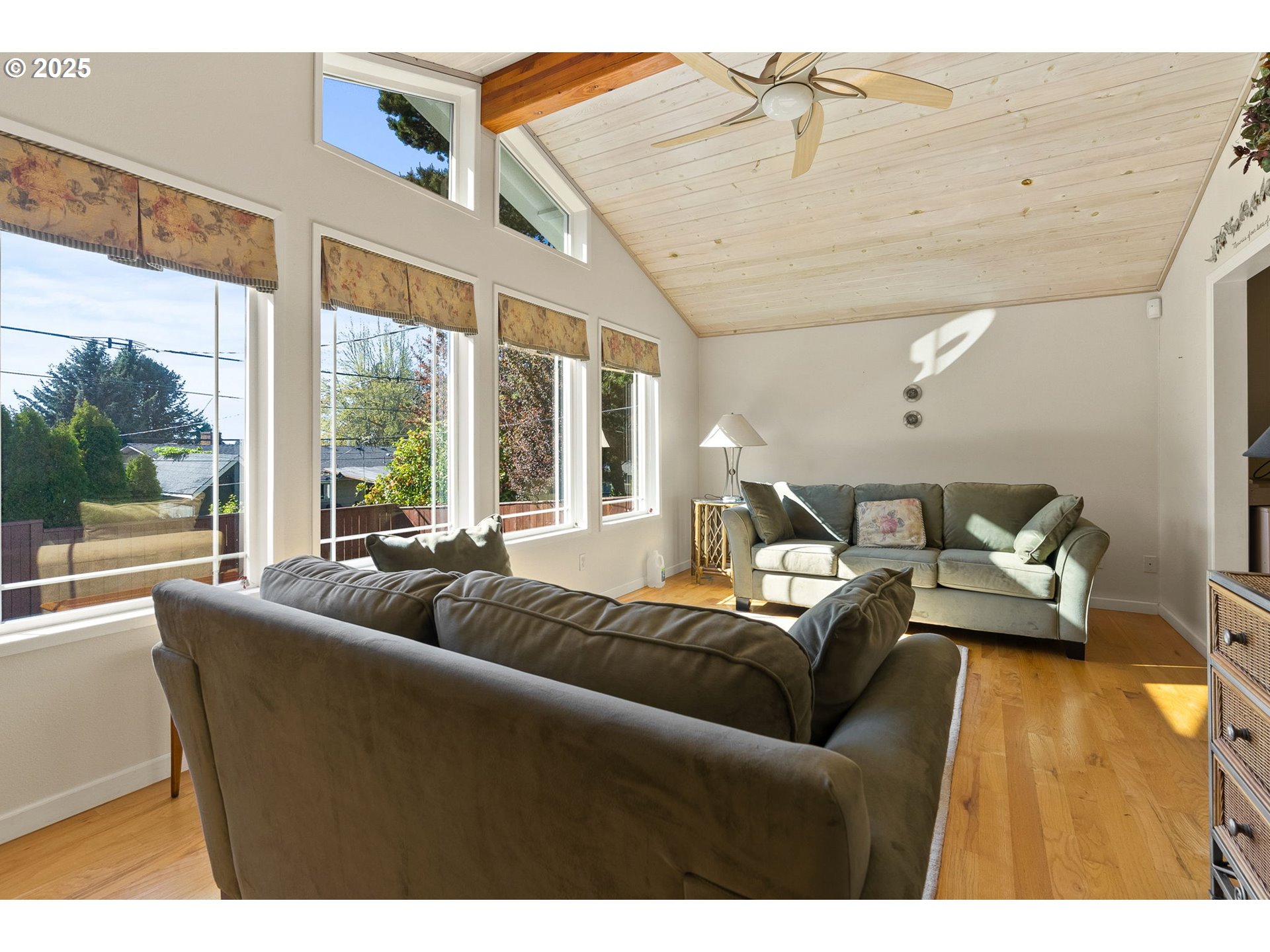 1055 Southeast 214th Avenue Gresham, OR 97030 - Photo 22 of 38 a living room with furniture and a large window