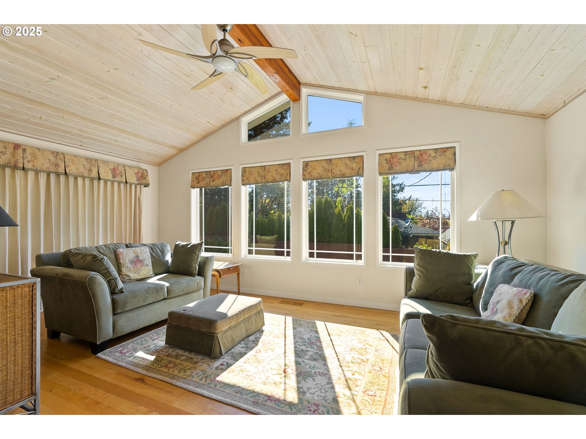 1055 Southeast 214th Avenue Gresham, OR 97030 - Photo 23 of 38 a living room with furniture and a large window
