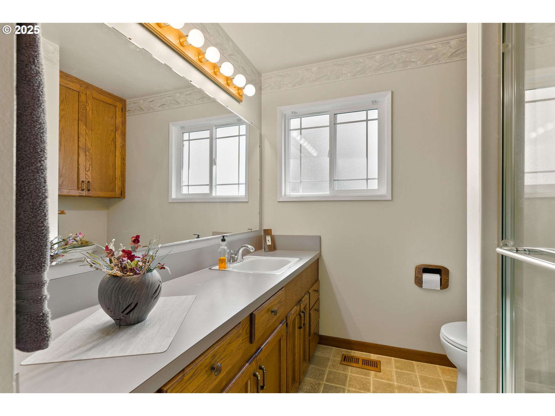 1055 Southeast 214th Avenue Gresham, OR 97030 - Photo 27 of 38 a bathroom with a sink a toilet and tub