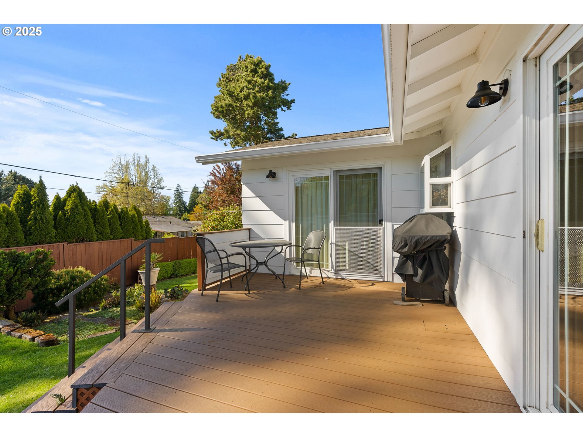 1055 Southeast 214th Avenue Gresham, OR 97030 - Photo 32 of 38 a view of a porch with furniture and garden