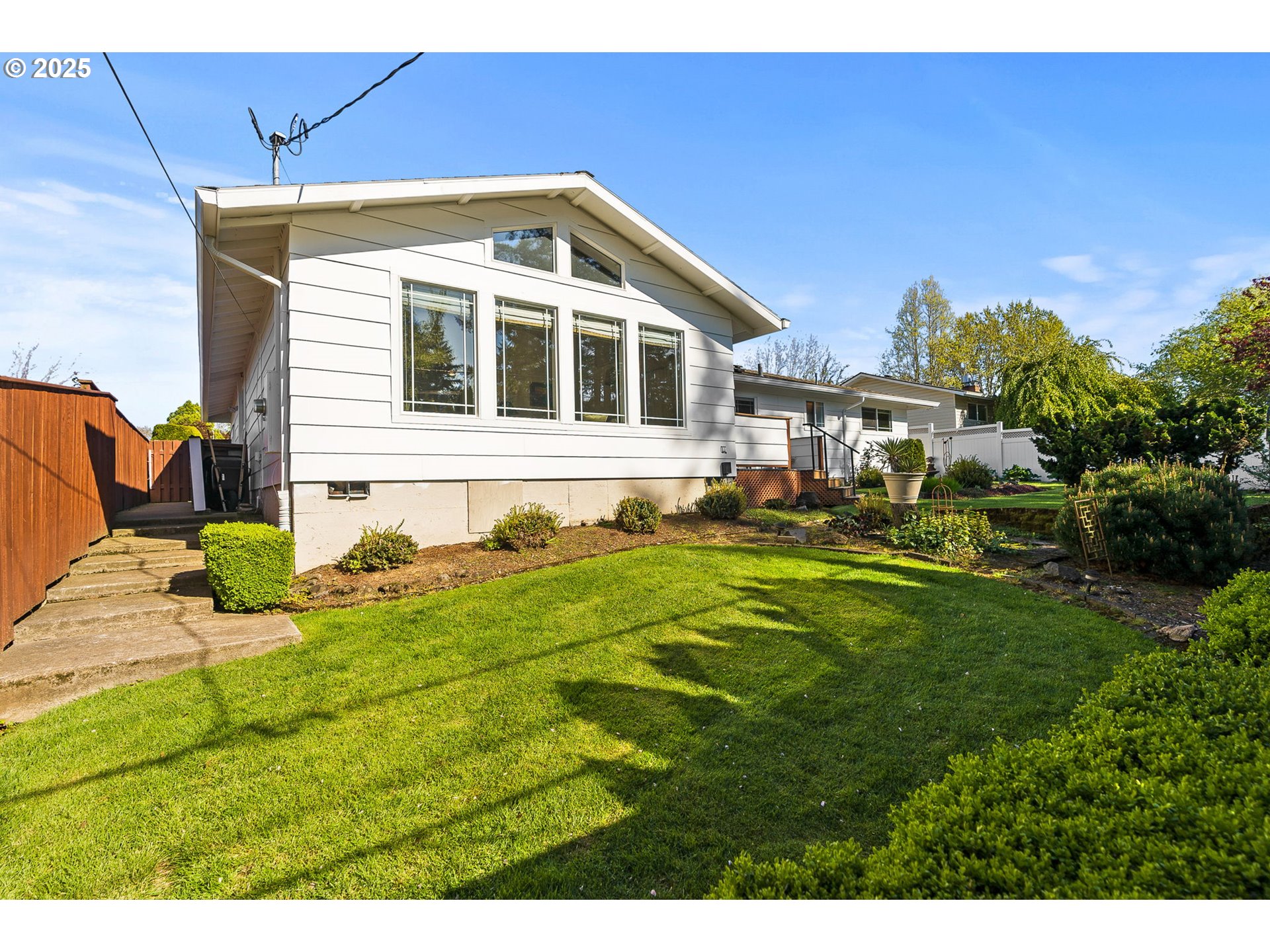 1055 Southeast 214th Avenue Gresham, OR 97030 - Photo 36 of 38 a front view of a house with a yard