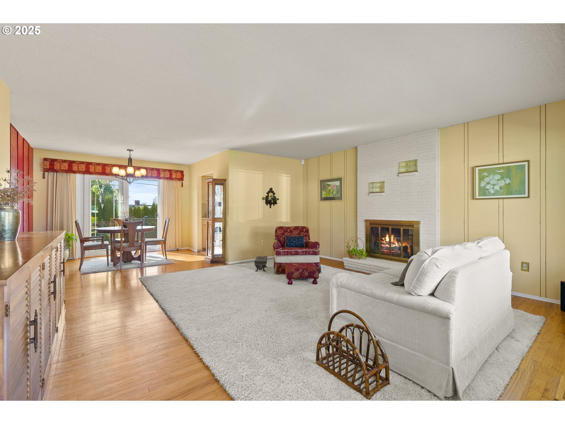 1055 Southeast 214th Avenue Gresham, OR 97030 - Photo 8 of 38 a living room with furniture and a fireplace