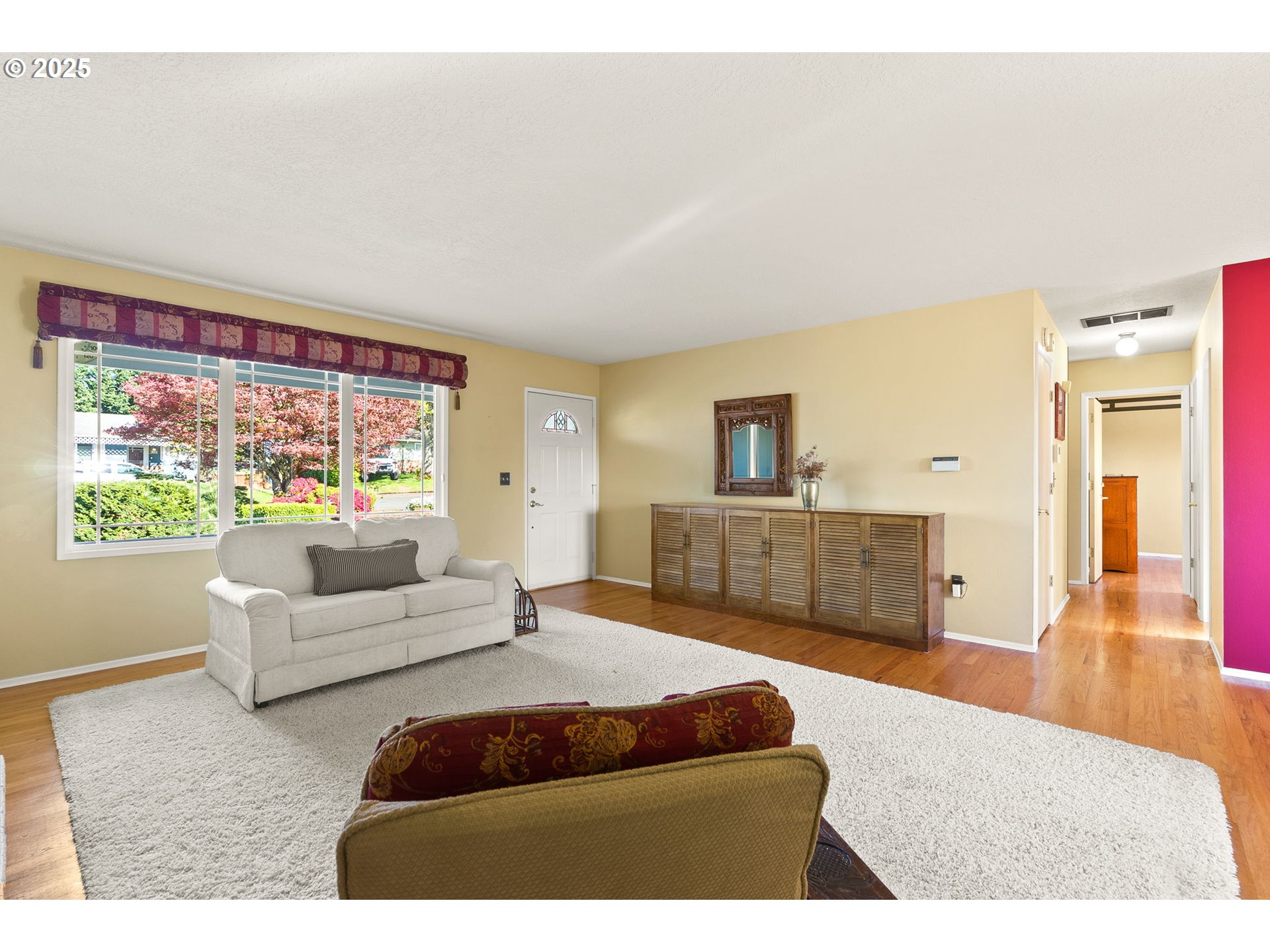 1055 Southeast 214th Avenue Gresham, OR 97030 - Photo 9 of 38 a bedroom with furniture and a large window