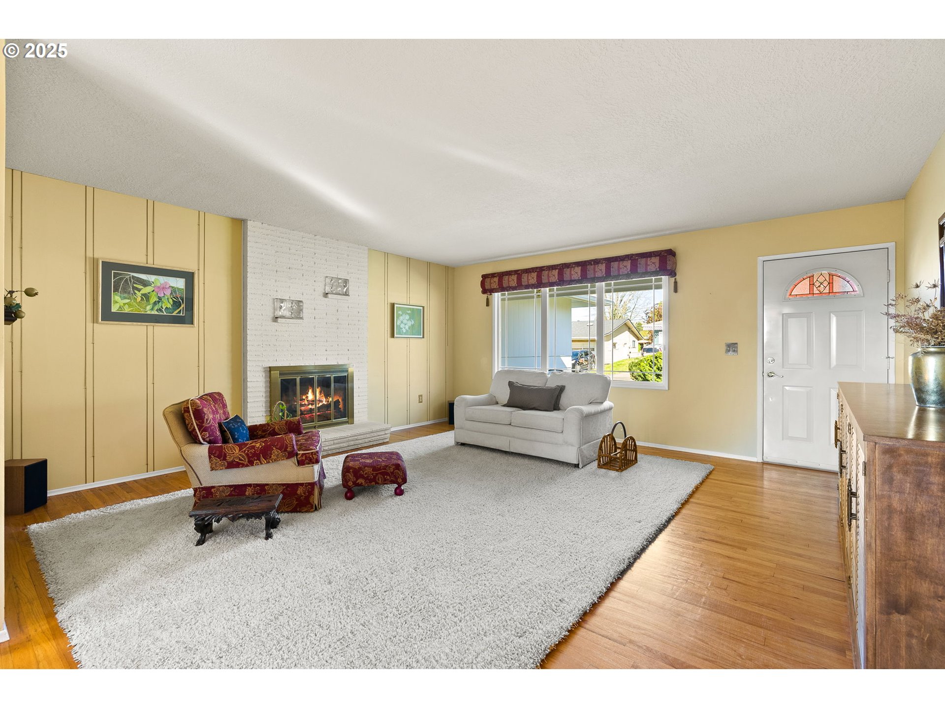 1055 Southeast 214th Avenue Gresham, OR 97030 - Photo 10 of 38 a living room with furniture and a fireplace