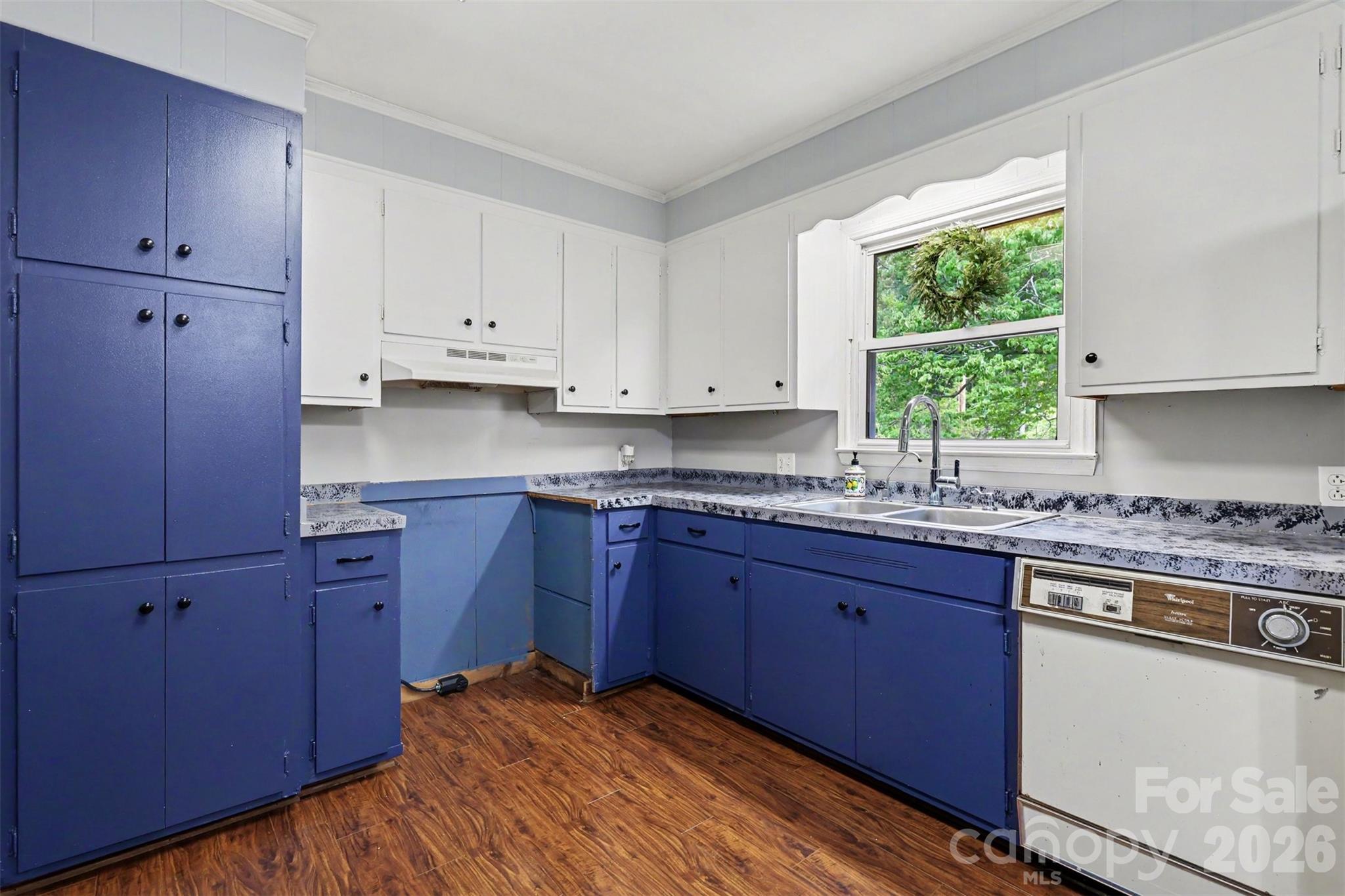 6774 Woodhaven Road Kershaw, SC 29067 - Photo 14 of 30 a kitchen with stainless steel appliances granite countertop wooden cabinets and a stove top oven