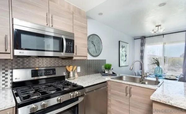 a kitchen with a stove and a microwave