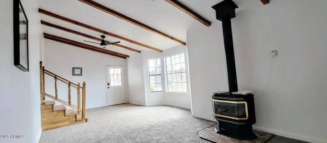 a view of a hallway with windows