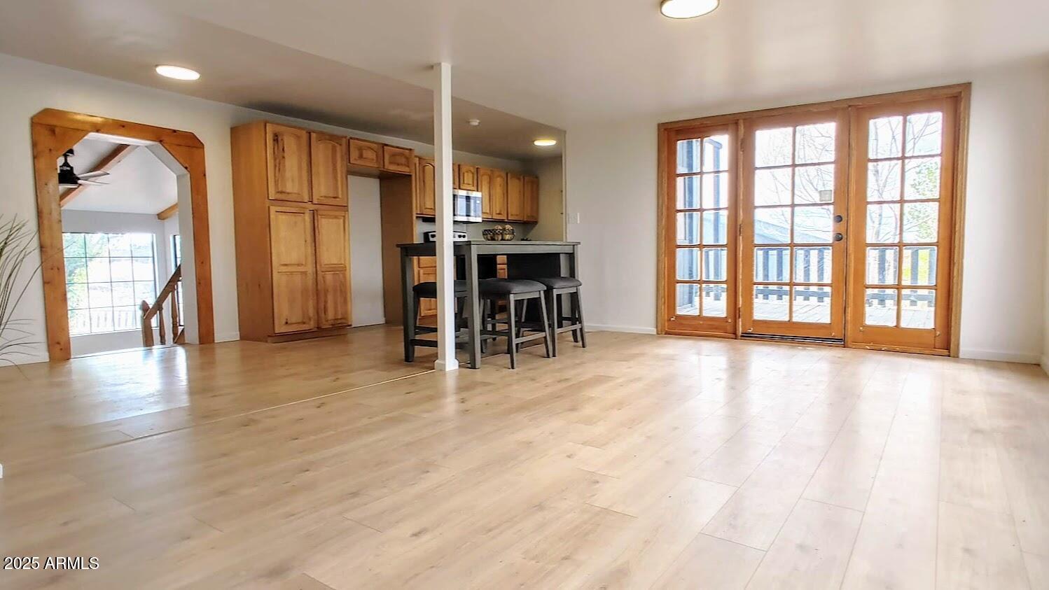 5214 Sour Dough Road Snowflake, AZ 85937 - Photo 12 of 30 an empty room with wooden floor and windows