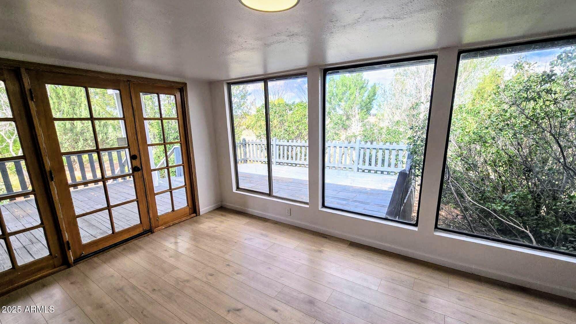 5214 Sour Dough Road Snowflake, AZ 85937 - Photo 13 of 30 a view of empty room with wooden floor and fan
