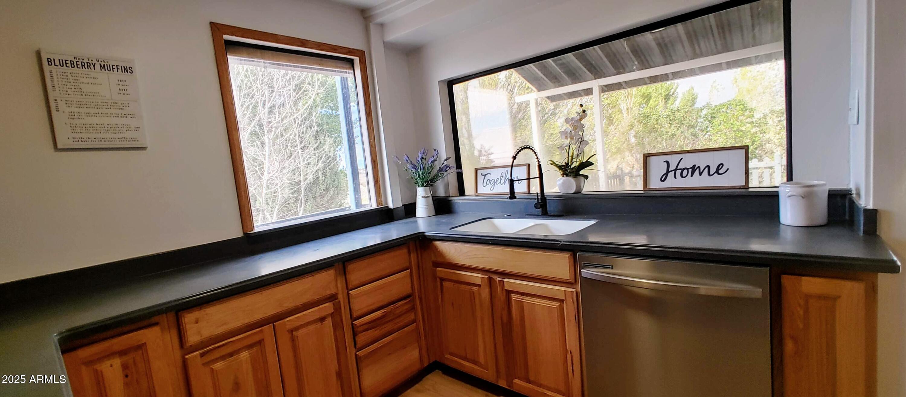 5214 Sour Dough Road Snowflake, AZ 85937 - Photo 14 of 30 a kitchen with a sink and large window