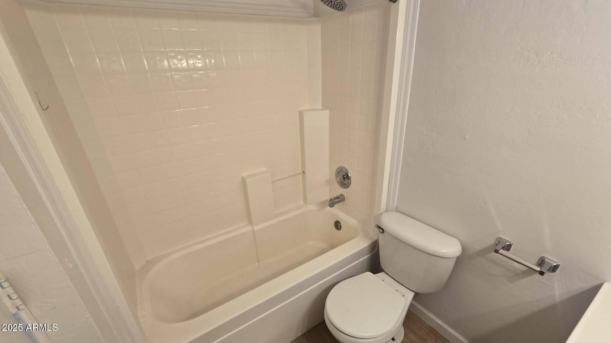 5214 Sour Dough Road Snowflake, AZ 85937 - Photo 20 of 30 a white toilet sitting next to a bath tub