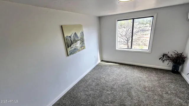 a view of a room that has a window in it