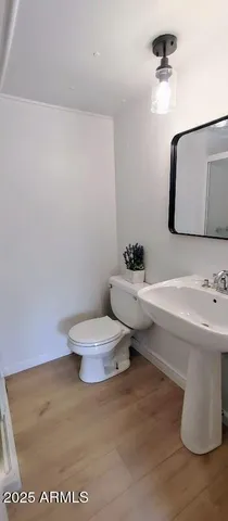 a view of a room with rack on the wall and a window