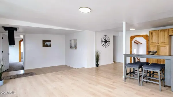 a bedroom with furniture and a window