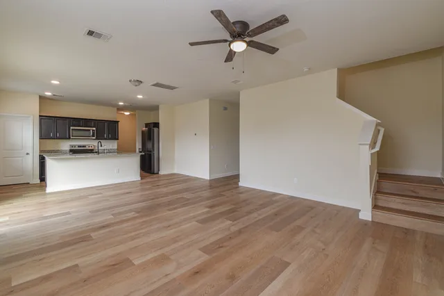 a view of a kitchen with a sink and a stove