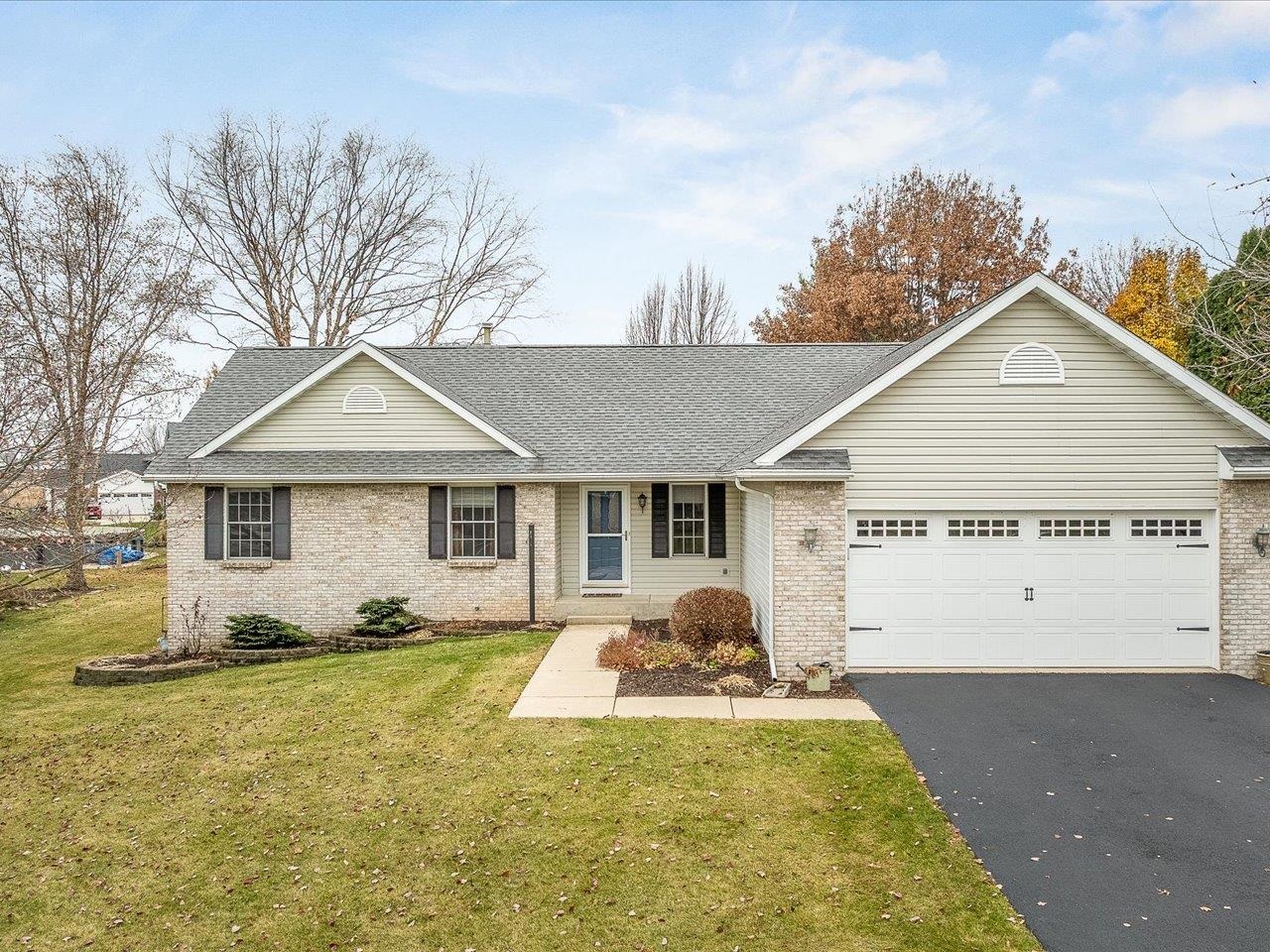 919 Gregory Way Winnebago, IL 61088 - Photo 1 of 47 a view of a house with backyard and trees
