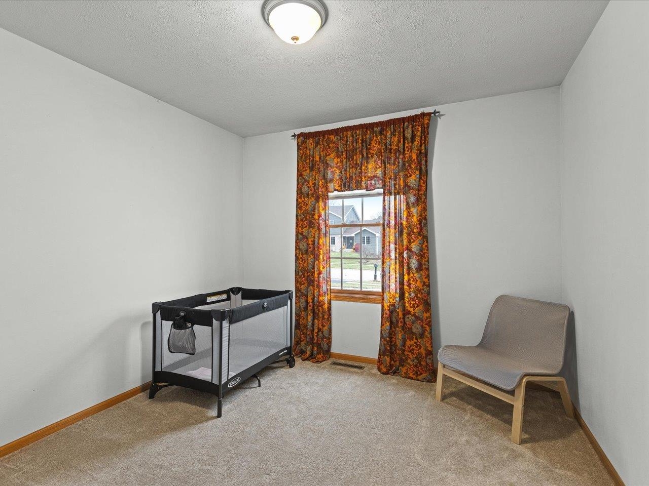 919 Gregory Way Winnebago, IL 61088 - Photo 18 of 47 a living room with furniture and a window