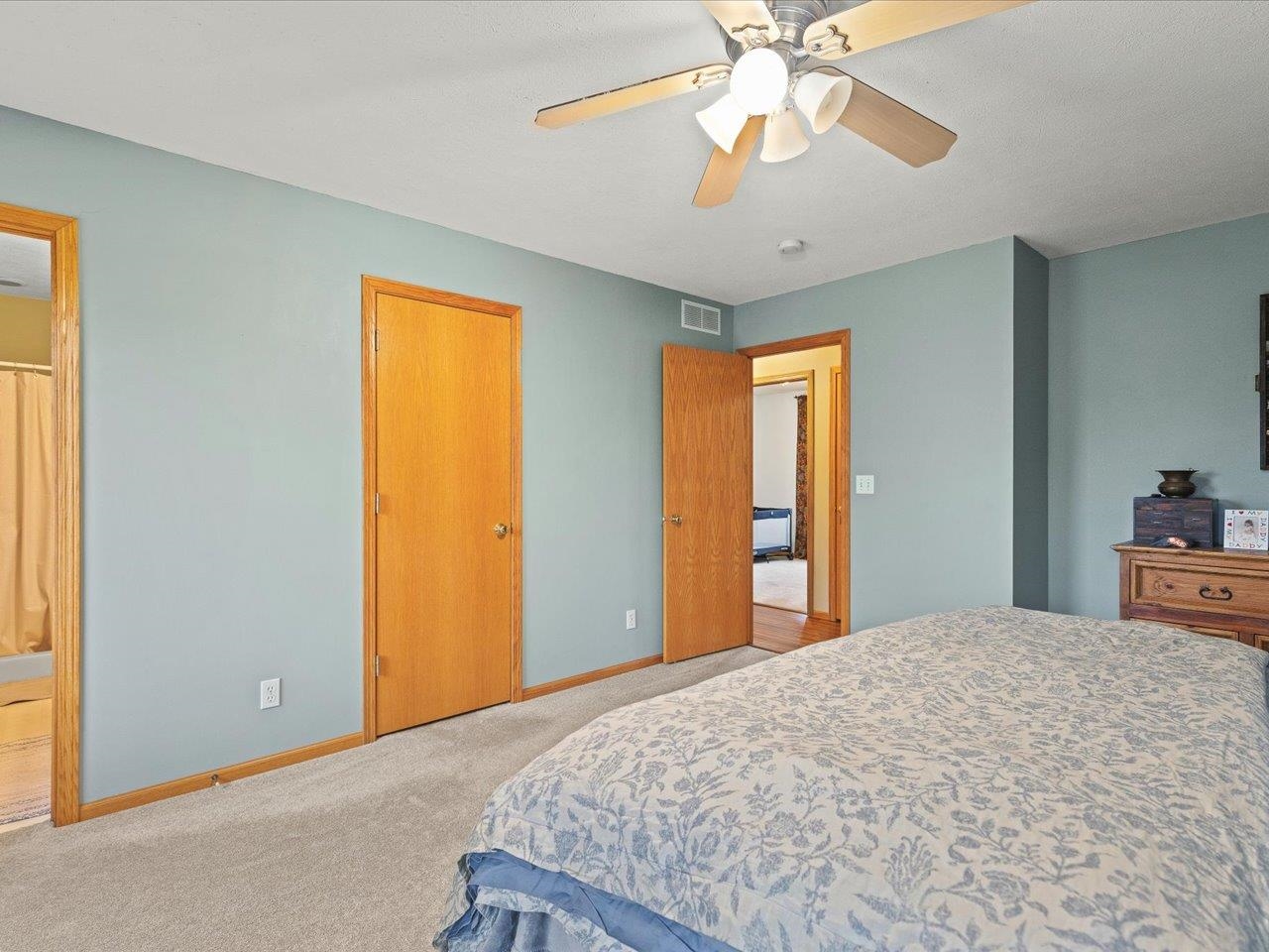 919 Gregory Way Winnebago, IL 61088 - Photo 23 of 47 a bedroom with a bed and a chandelier