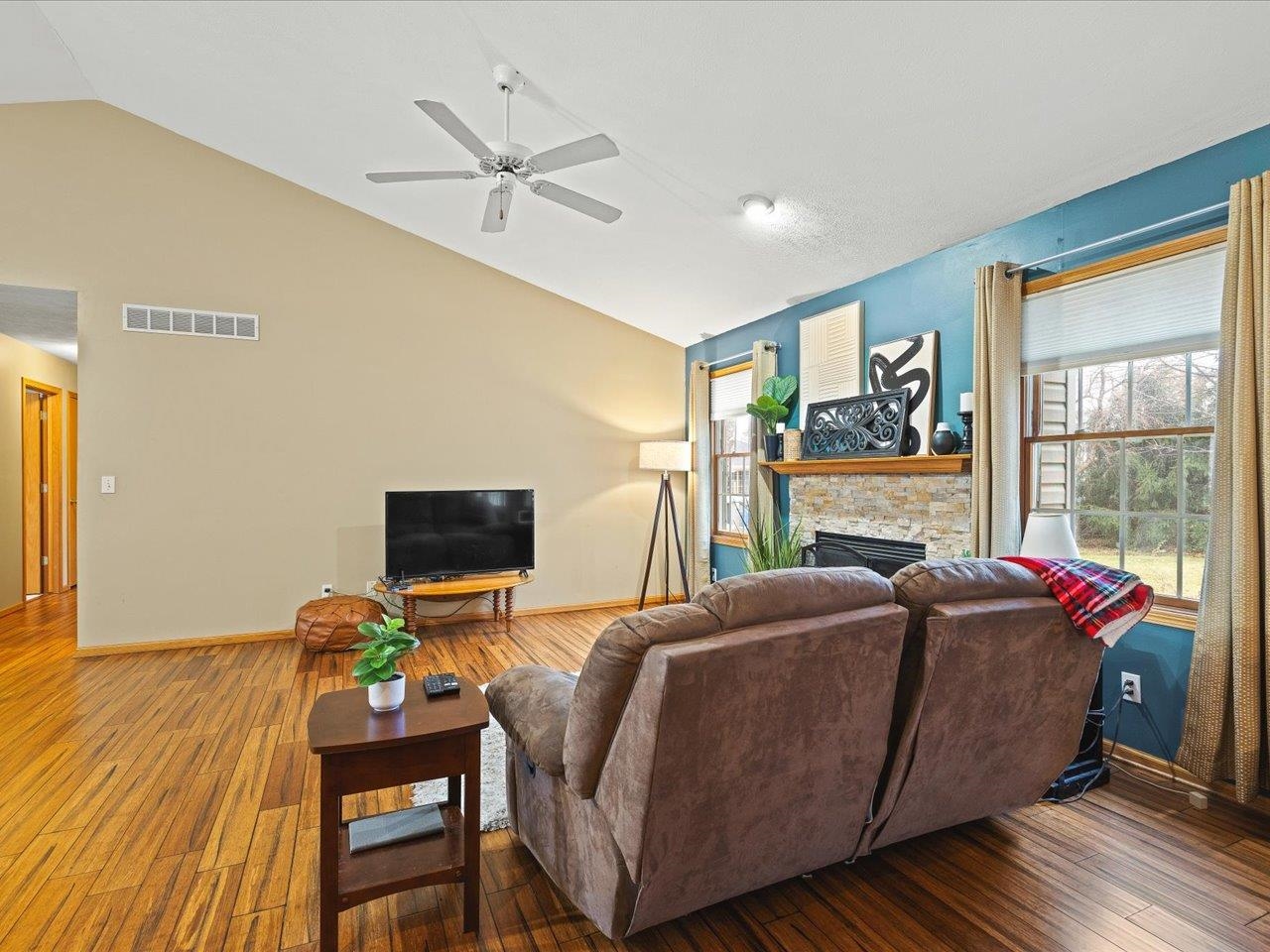 919 Gregory Way Winnebago, IL 61088 - Photo 6 of 47 a living room with furniture fireplace and a flat screen tv