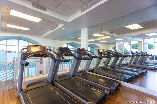 a view of a kitchen with a sink and cabinet