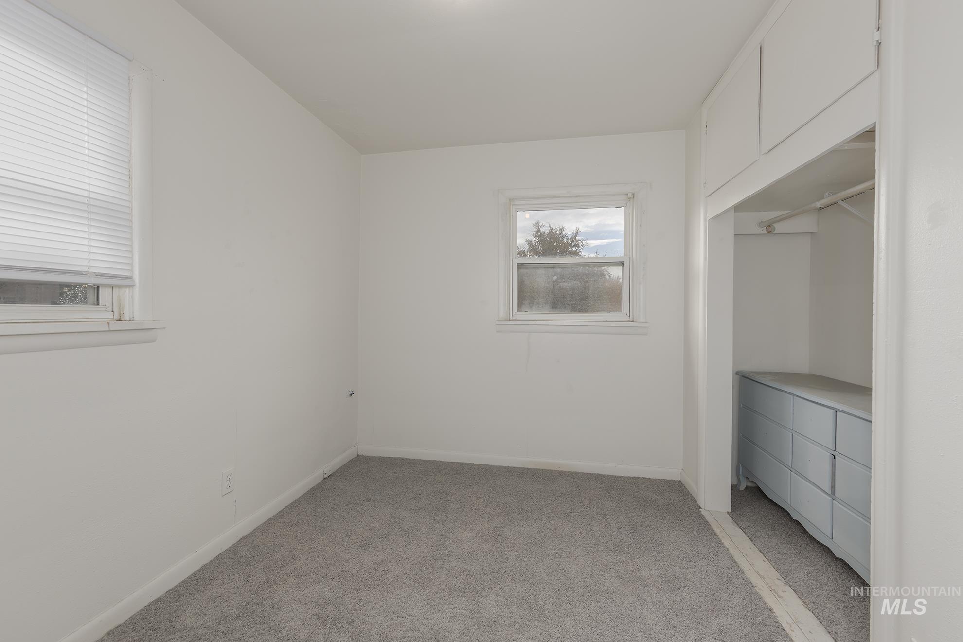 1602 2nd Avenue South Payette, ID 83661 - Photo 11 of 28 Unfurnished bedroom with light colored carpet and baseboards