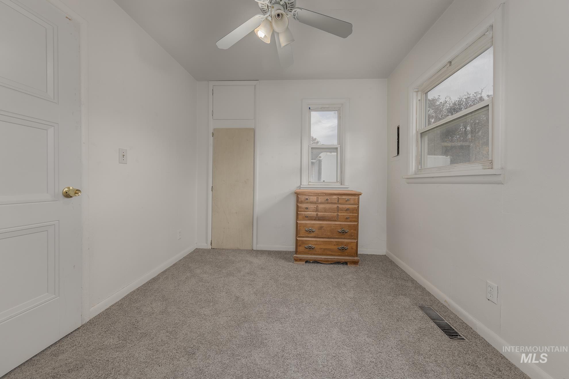 1602 2nd Avenue South Payette, ID 83661 - Photo 14 of 28 Unfurnished bedroom featuring carpet flooring and a ceiling fan