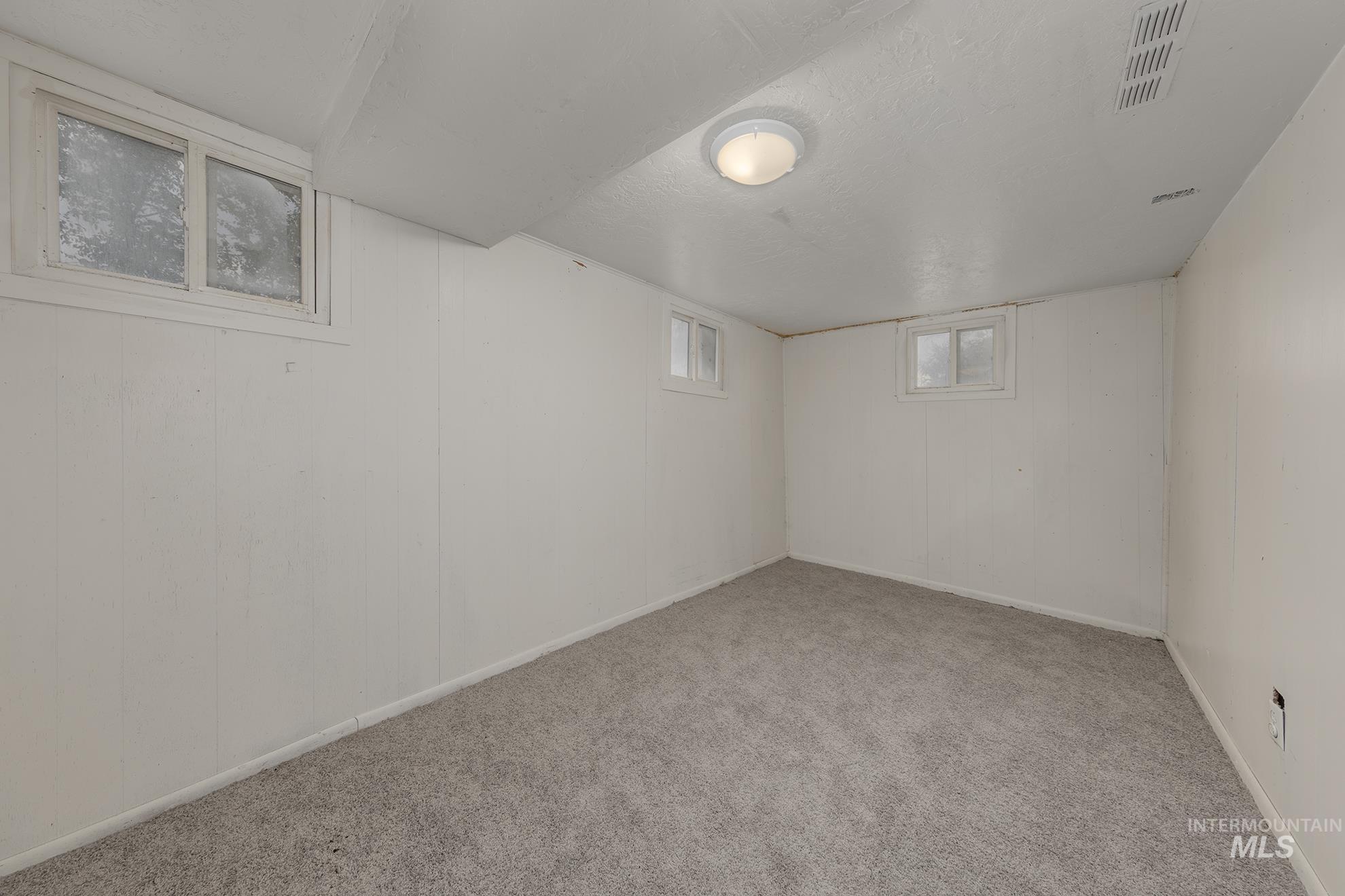 1602 2nd Avenue South Payette, ID 83661 - Photo 24 of 28 Below grade area with carpet and a textured ceiling