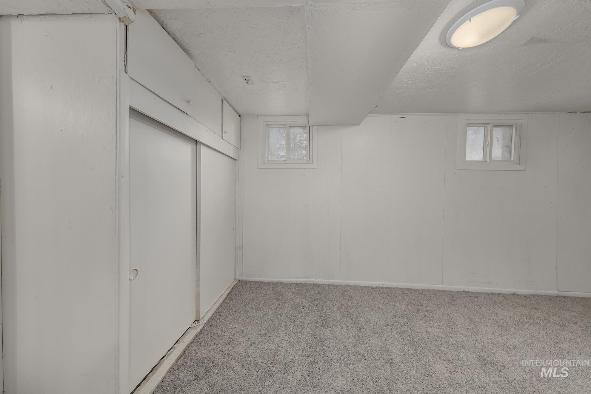 1602 2nd Avenue South Payette, ID 83661 - Photo 25 of 28 Below grade area with light carpet and baseboards