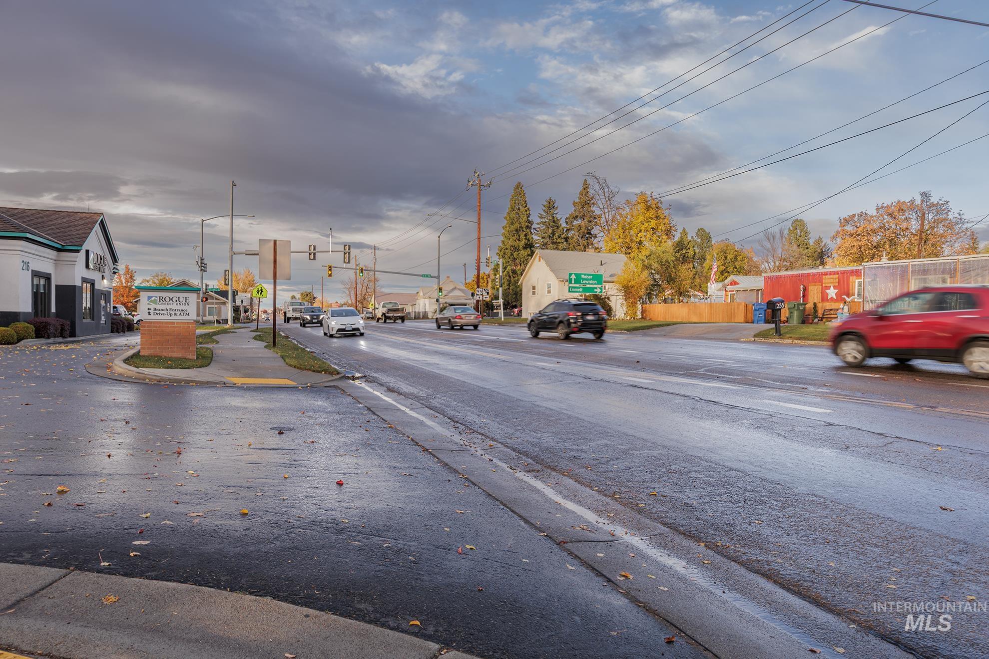 1602 2nd Avenue South Payette, ID 83661 - Photo 28 of 28 View of asphalt road featuring traffic lights, curbs, and sidewalks