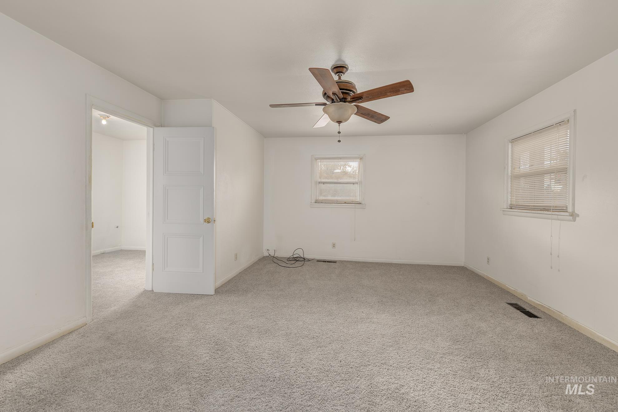 1602 2nd Avenue South Payette, ID 83661 - Photo 10 of 28 Unfurnished room with carpet floors and a ceiling fan