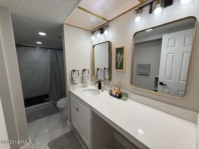 a bathroom with a double vanity sink a toilet and a mirror